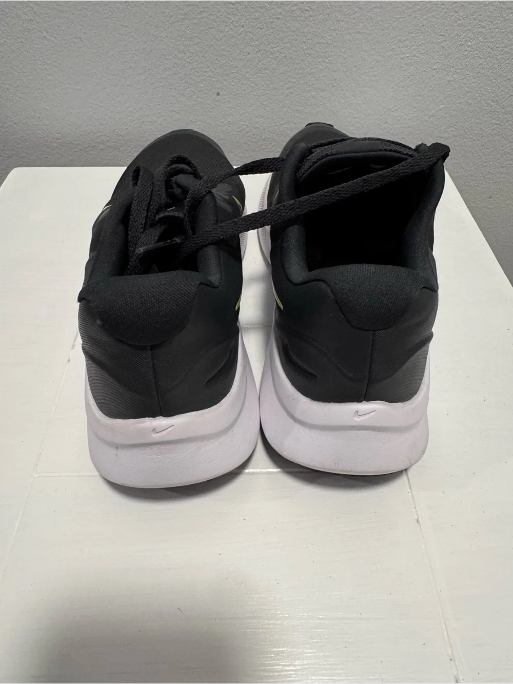 Nike Black Sneakers with Neon Yellow Swoosh and White Sole